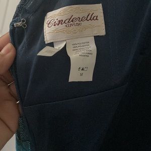 an beautiful blue shimmer dress it’s an size m it’s very long .